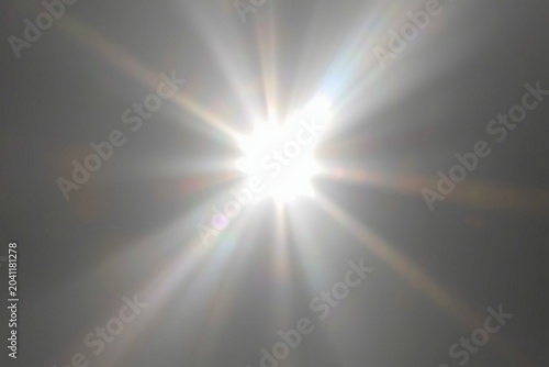 A glowing white light flare Photoshop overlay effect. A realistic, bright light ray soft gradient on a transparent background high-quality effect, photo and videos for editors. luminous shine