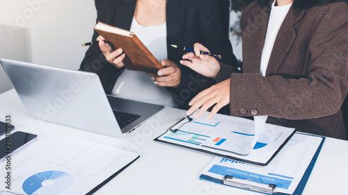 Accountants processing financial documents and taxes, managing corporate finance in a modern office. Audit and taxes in business