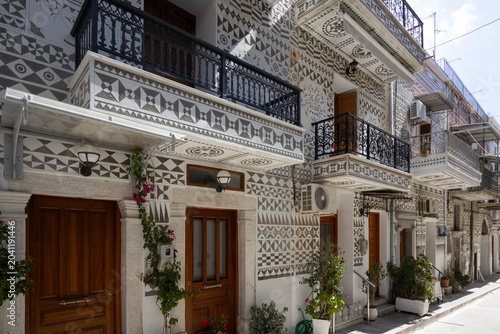 Traditional geometric scratch patterns on house facades in Pyrgi village, Chios island, Greece