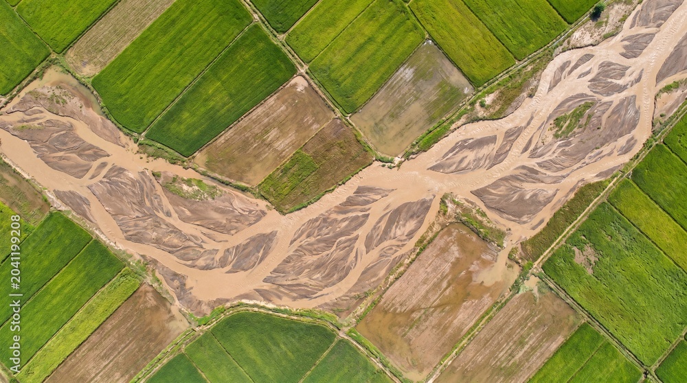 Fototapeta premium Braided flood channels aerial, Super El Nino rainfall patterns, Climate disaster farmland, Abstract landscape texture, Copy space