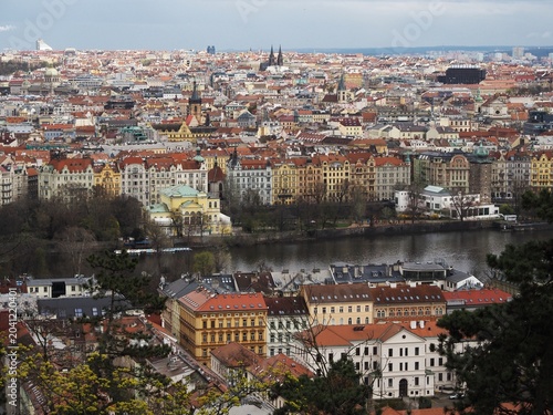 View of Prague from above: European architecture, cathedrals, streets, embankment and bridges. Czech Republic.