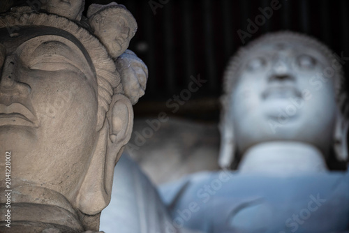 Fotografi Taiyuan, China - May 7 2026: Ancient Buddhist statue in the Tianlong Mountain Gr