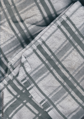 Texture of a blue and white plaid fabric with soft shadows