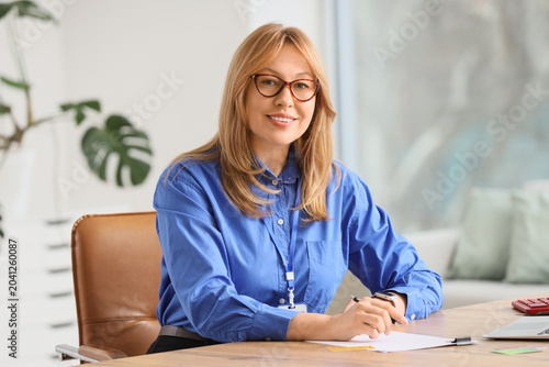 Female bank manager working...