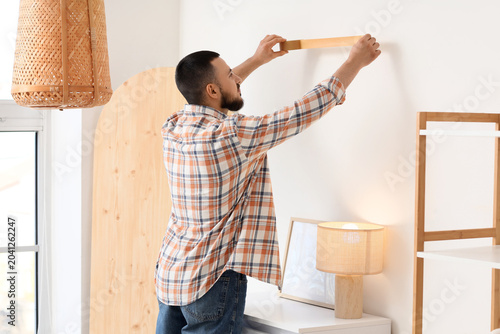Young man applying masking ...