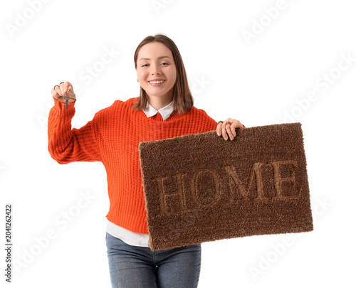 Young woman with key and do...