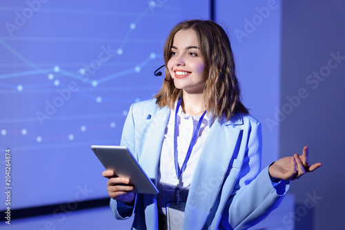 Female business speaker wit...