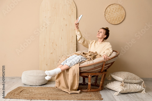Young happy woman with mobi...
