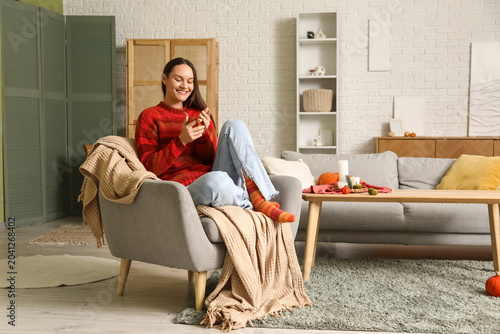 Young happy woman with cup ...