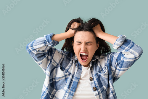 Angry young woman screaming...