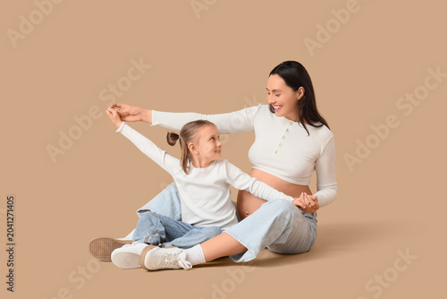 Happy pregnant woman and he...