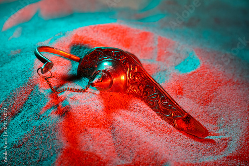 Canvastavla Lamp of Aladdin on color sand