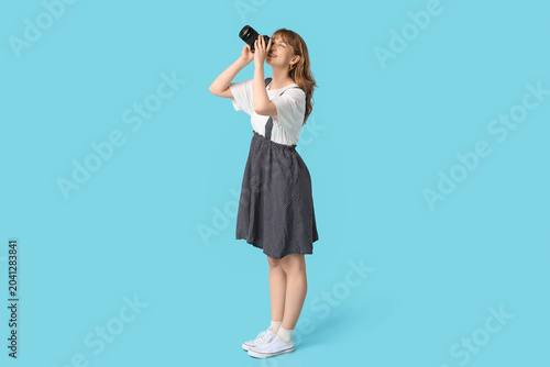 Beautiful young woman takin...