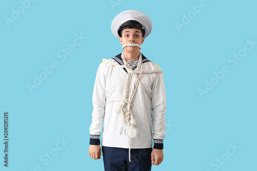 Young sailor tied with rope...