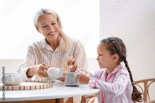 Little girl with her grandm...