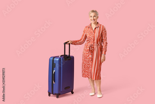 Mature woman with suitcase ...