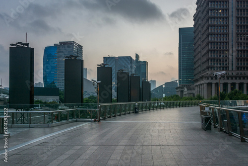 Modern Urban Architecture with Empty Pedestrian Walkway at Dusk