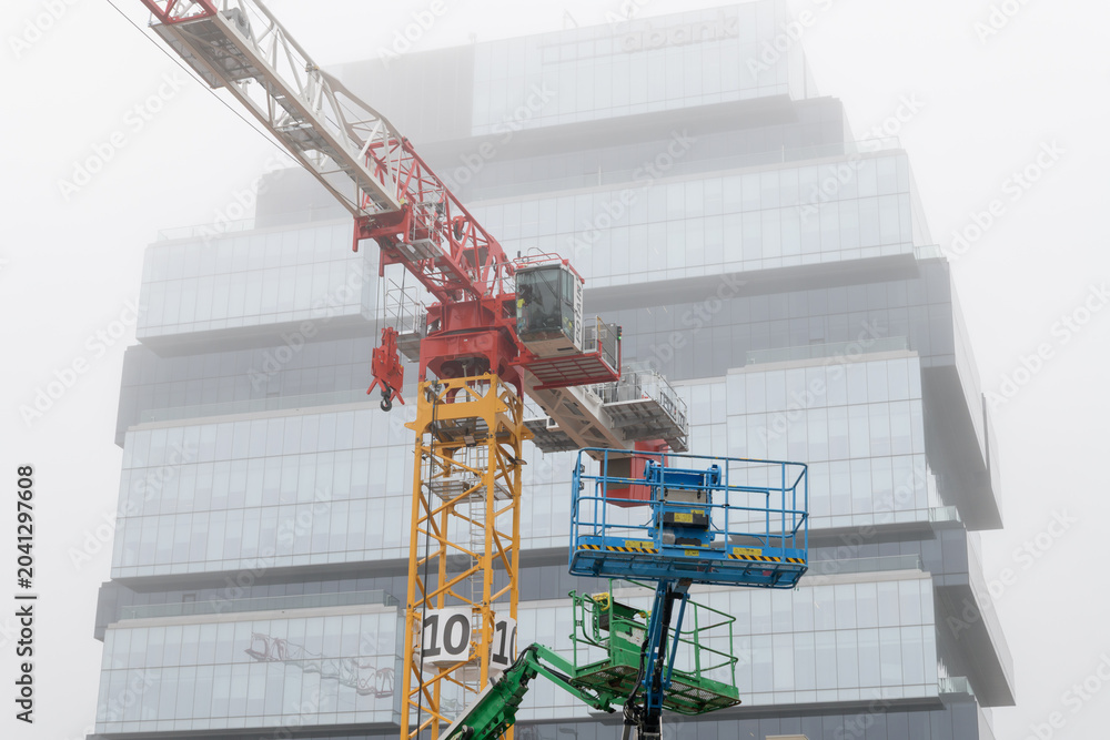 Naklejka premium crane at construction site of Ontario Line, Distillery District station formerly Corktown station, King Street East, Front Street East, Parliament Street, and Berkeley Street, Toronto