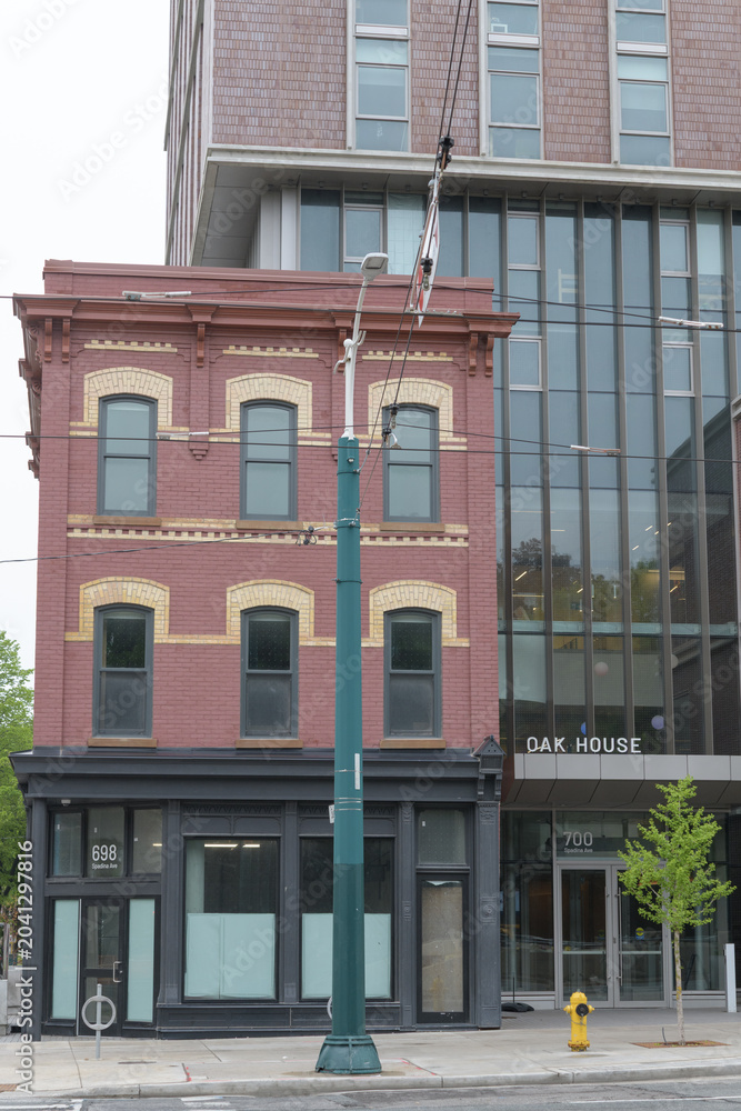 Naklejka premium exterior of Oak House, a student dormitory, located at 700 Spadina Av, Toronto - includes historic John James Funston’s Grocery (1885), 698 Spadina Av