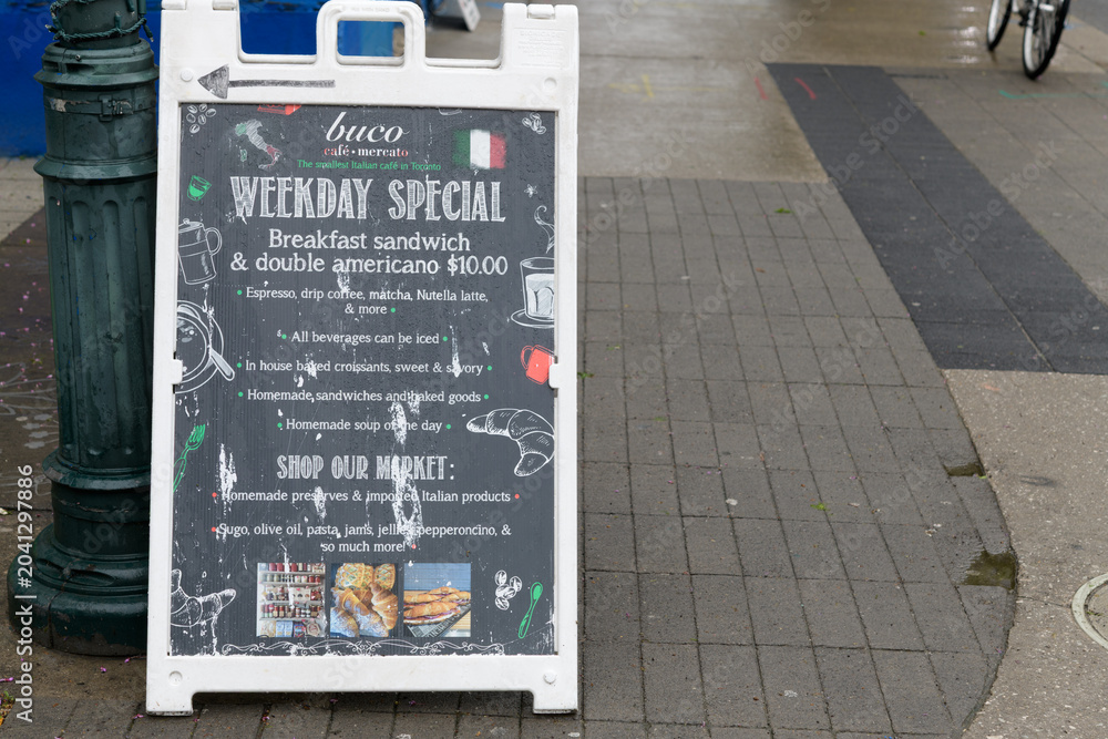 Naklejka premium a-frame sidewalk chalkboard sign at Buco Café Mercato, 615A Brock Av, north of Bloor St W, Toronto