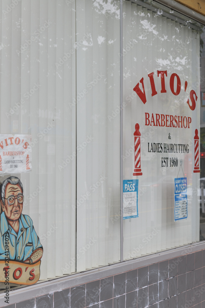 Naklejka premium display window with signs at Vito Barber Shop located at 1258 Bloor St W, Toronto