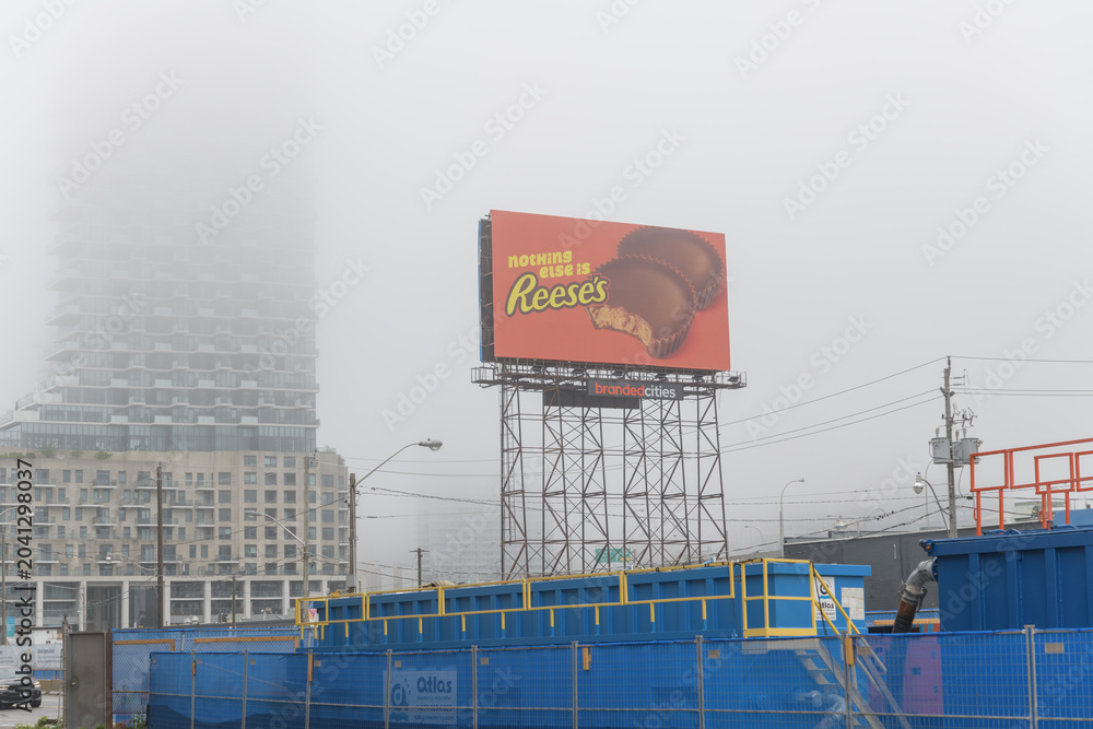Naklejka premium construction site at Queens Quay E and Small St including a Scaffold Spectacular with advertising for Reese's, Toronto