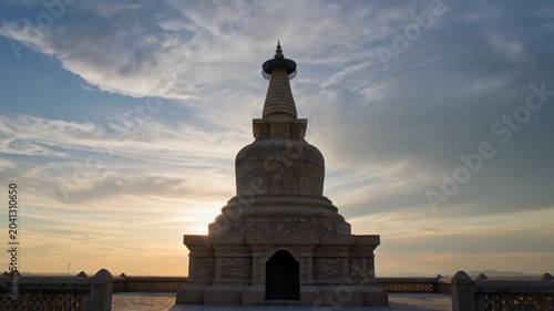 Ancient Buddhist Stupa at Sunset with Dramatic Sky