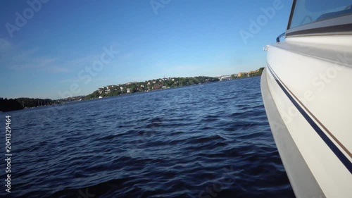 Stockholm, Sweden A view of the water of Lake Malaren from a moving motorboat on a sunny summer day. 