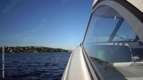 Stockholm, Sweden A view of the water of Lake Malaren from a moving motorboat on a sunny summer day. 