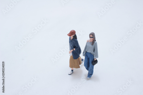 Miniature figures walking casual lifestyle scene