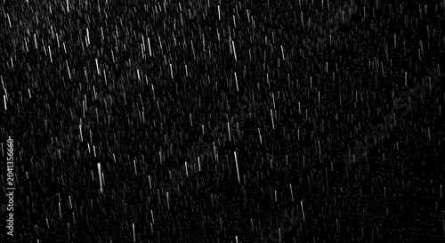 Heavy rain falling against a dark black background, perfect for overlay and texture effects in graphic design.