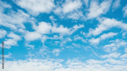 Dynamic time-lapse of cloud formation and movement in a bright, sunny afternoon.