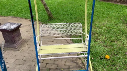 Relaxing Outdoor Swing Chair in Green Garden