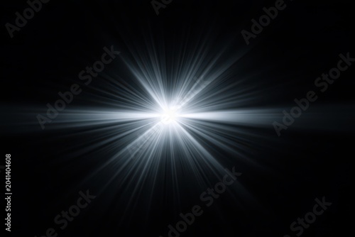Bright, abstract light burst radiating outward in a dark setting.