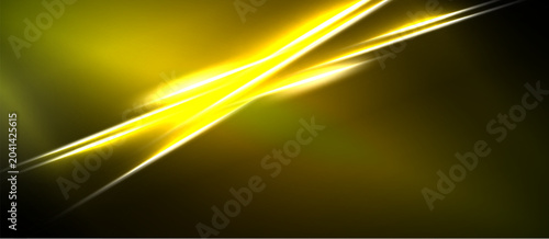 Foto Bright yellow lines cross dark background