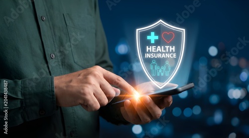 Hand holding digital health shield icon with medical cross on futuristic interface in blue lighting