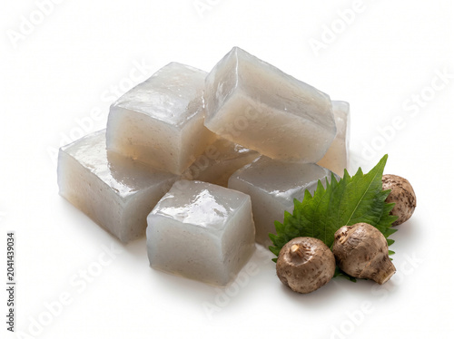 Konjac jelly cubes with fresh konjac roots isolated on white background
