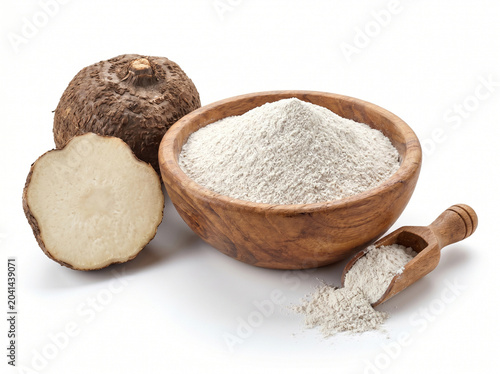 Konjac flour in wooden bowl with fresh konjac root isolated on white background