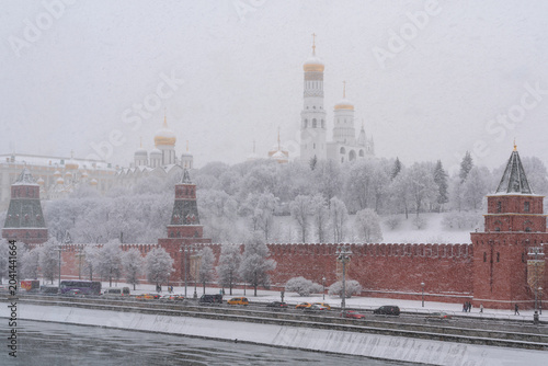 Architectural ensemble of the Moscow Kremlin from the embankment of the Moskva River during heavy snowfall, Moscow, Russia