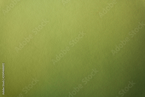 Bright pure green matcha tone color paint on paper texture background 