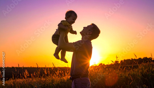 Family silhouette against sunset sky