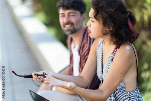 Tableau sur toile Two people have an animated conversation outdoors, focusing on deepening their f