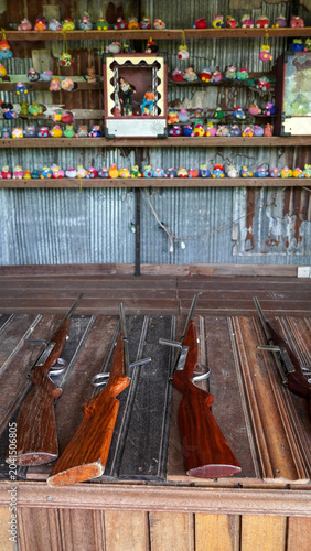 Photos Vintage shooting gallery game at a traditional festival