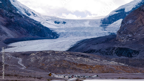 Quadro su tela Athabasca Glacier with rocky moraine and tourist parking in Alberta