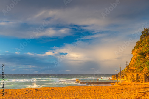 Seaside Sunrise with a hint of rain in the clouds
