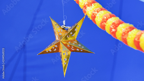 Photography Golden star decoration and marigold garland for India Day celebration in Moscow