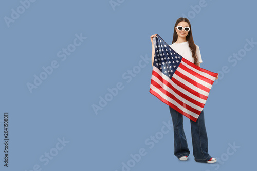Obraz na plátně Young woman waves American flag