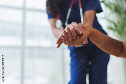Healthcare worker offering support and comfort to patient