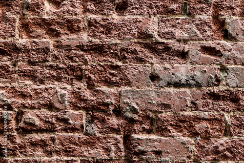 Slika na platnu A full-frame, gritty texture of a weathered red brick wall