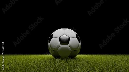 Classic soccer ball on green grass field with black background at night. Professional football on stadium turf under spotlight for sports competition, championship match, and athletic training